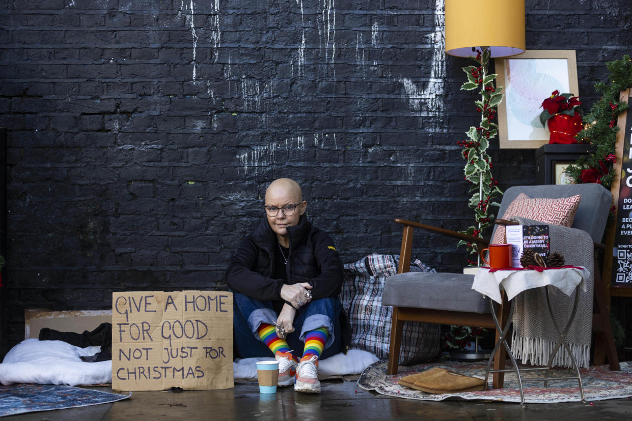 Porter sits in an installation by Single Homeless Project to raise awareness of Londoners facing homelessness, November 2022. (PA Images)