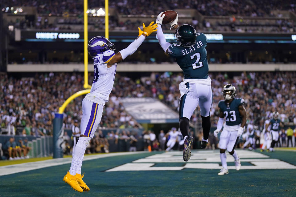 Philadelphia Eagles cornerback Darius Slay (2) intercepts a pass intended for Minnesota Vikings wide receiver Justin Jefferson, left, during the second half of an NFL football game, Monday, Sept. 19, 2022, in Philadelphia. (AP Photo/Matt Slocum)