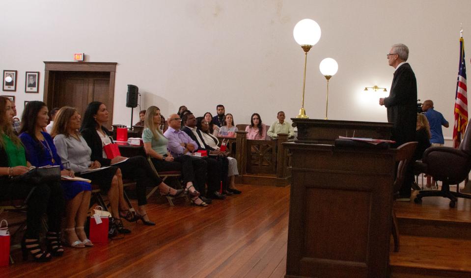 U.S. Magistrate Judge Christopher Tuite addresses applicants for citizenship Friday morning during the first of two naturalization  ceremonies at the Polk History Center in Bartow. The ceremony included immigrants from Colombia, Hungary and Italy, among other countries.