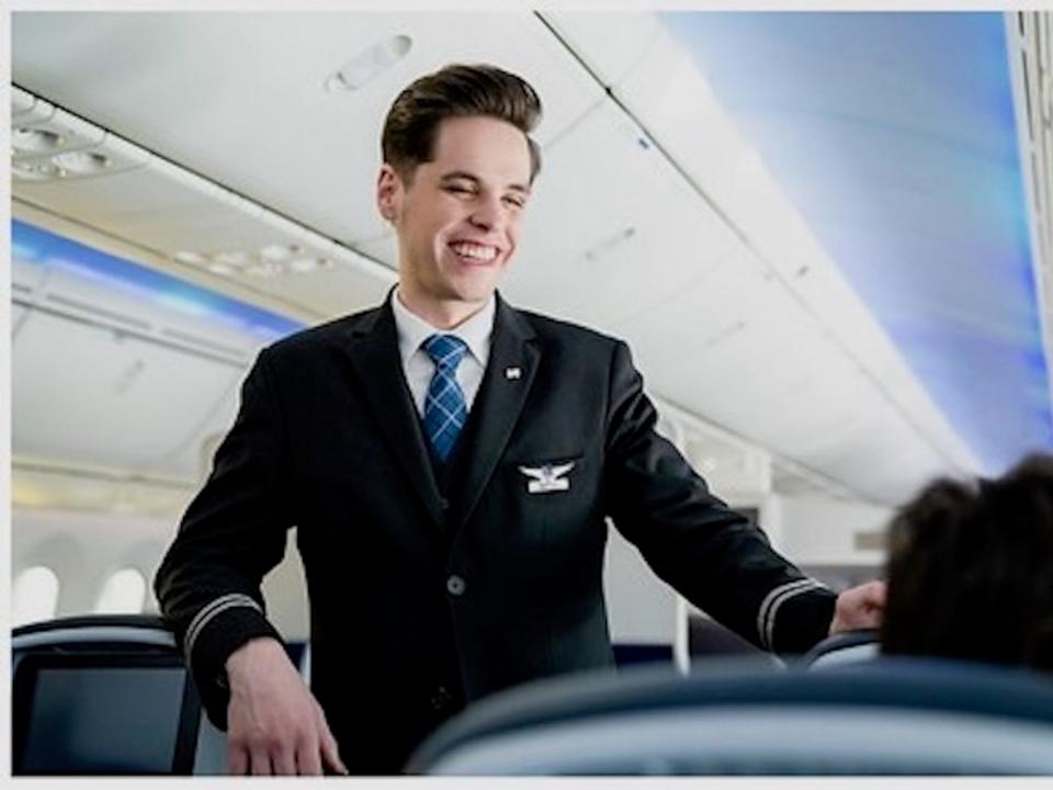 United flight attendants wearing pronoun pins.