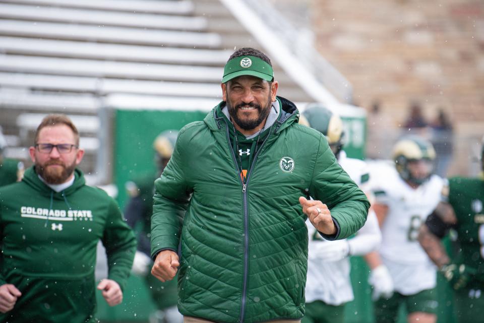 Colorado State University head football coach Jay Norvell runs onto the field before the Green and Gold Spring Game on Saturday at Canvas Stadium in Fort Collins.