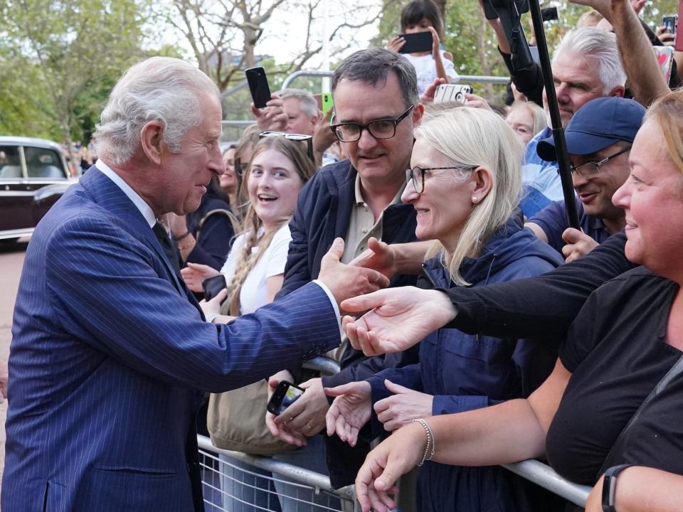 King Charles shakes hands with well-wishers at Clarence House in London on September 10, 2022.