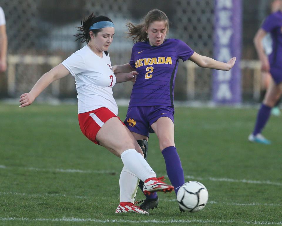 Nevada's Tori Meinecke (2) kicks the ball past North Polk's Molly Bergstrom (7) during the first half of the Class 1A No. 4 Cubs' 1-0 victory over 2A No. 3 North Polk. Meinecke has been the engine driving the Nevada offense with four goals and the third-most assists in 1A at seven.