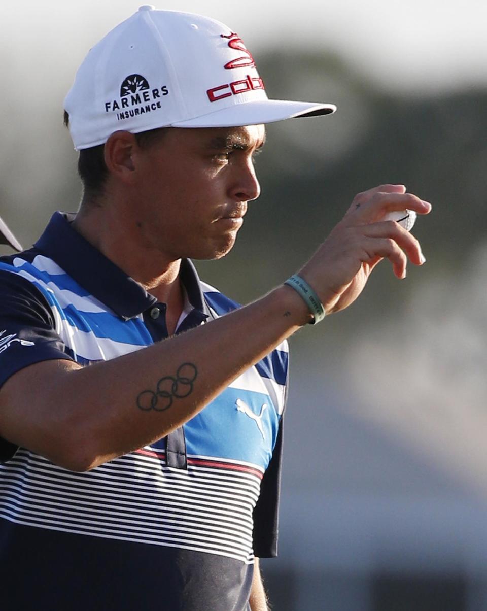 Rickie Fowler acknowledges the crowd after finishing the third round of the Honda Classic golf tournament, Saturday, Feb. 25, 2017, in Palm Beach Gardens, Fla. (AP Photo/Wilfredo Lee)