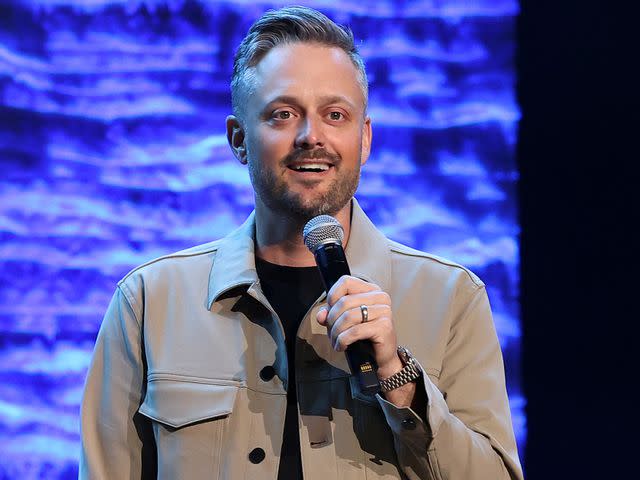 <p>Terry Wyatt/Getty </p> Nate Bargatze speaks onstage for 'A Country Thing Happened On The Way To Cure Parkinson's' benefitting The Michael J. Fox Foundation in April 2023 in Nashville, Tennessee.