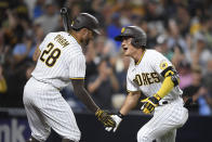 San Diego Padres second baseman Ha-Seong Kim (7) is congratulated by Tommy Pham (28) after hitting a solo home run during the fifth inning of a baseball game against Los Angeles Dodgers Tuesday, June 22, 2021, in San Diego. (AP Photo/Denis Poroy)