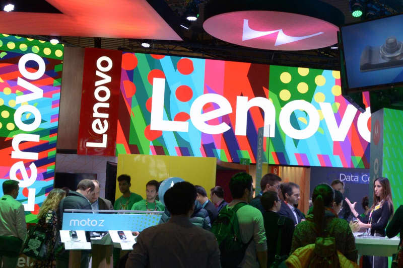 Trade fair visitors bustle around the stand of the world's largest PC manufacturer Lenovo and its Motorola brand at the Mobile World Congress in Barcelona. Andrej Sokolow/dpa