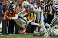 Denver Broncos wide receiver Courtland Sutton (14) makes a catch as Indianapolis Colts linebacker Bobby Okereke (58) defends during the second half of an NFL football game, Thursday, Oct. 6, 2022, in Denver. (AP Photo/Jack Dempsey)