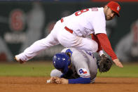 ST LOUIS, MO - OCTOBER 20: Nick Punto #8 of the St. Louis Cardinals turns the double play as Ian Kinsler #5 of the Texas Rangers slides into second base in the sixth inning during Game Two of the MLB World Series at Busch Stadium on October 20, 2011 in St Louis, Missouri. (Photo by Ezra Shaw/Getty Images)