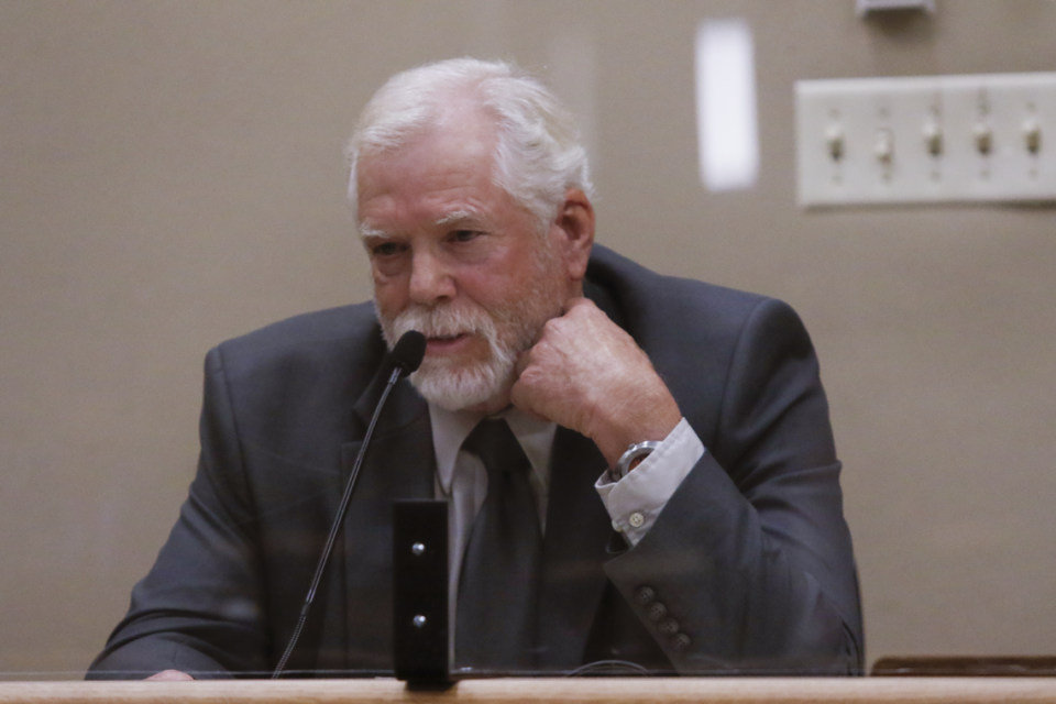 On the witness stand, retired California State Park Rangers David Berry gestures toward his neck describing where he saw a bullet wound on Stephen Arthur Deflaun. Deflaun’s double-murder trial was held at the San Luis Obispo Superior Court, on Thursday, Mar. 30, 2023.