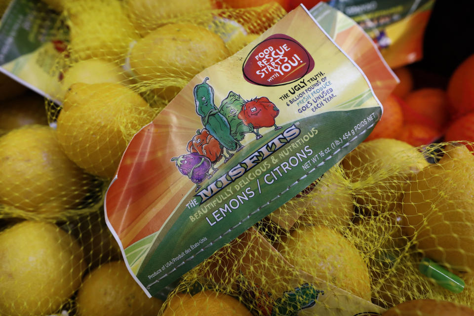 In this Friday, Jan. 18, 2019, photo, lemons are seen on display in the imperfect produce section at the Hy-Vee grocery store in Urbandale, Iowa. Some stores and home delivery startups haven’t given up on the idea of selling less-than-perfect produce to reduce food waste. (AP Photo/Charlie Neibergall)