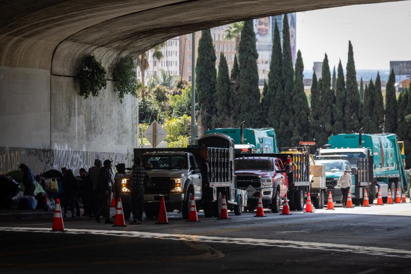 Los Angeles, CA - March 07: Mayor Karen Bass's Inside Safe team clears an encampment on Cahuenga Boulevard under the 101 Freeway on Thursday, March 7, 2024 in Los Angeles, CA. (Jason Armond / Los Angeles Times)