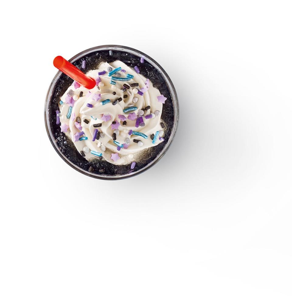 The new drink will include flavors of cotton candy and dragon fruit, according to Sonic, with the all-black slush representing the temporary darkness from the solar eclipse and will be topped with white soft serve and blue and purple galaxy themed sprinkles.