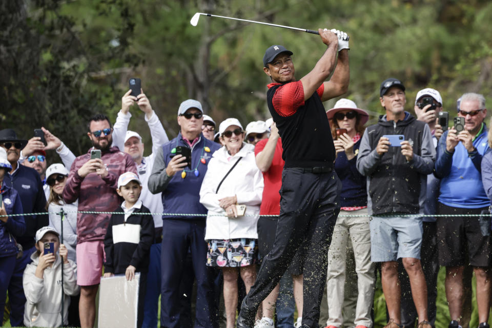 Tiger Woods tees off on the 4th hole during the final round of the PNC Championship golf tournament Sunday, Dec. 18, 2022, in Orlando, Fla. (AP Photo/Kevin Kolczynski)