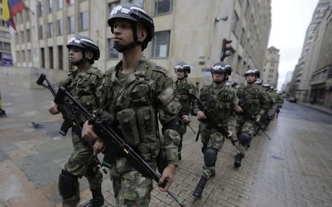 Soldiers are deployed at Bolivar Square in Bogota as voters go the polls in an election once again dominated by the security situation - Credit: JOHN VIZCAINO/AFP