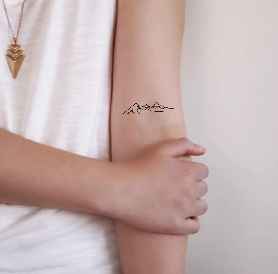 Mountain Temporary Tattoos on woman's forearm (Photo via Etsy)