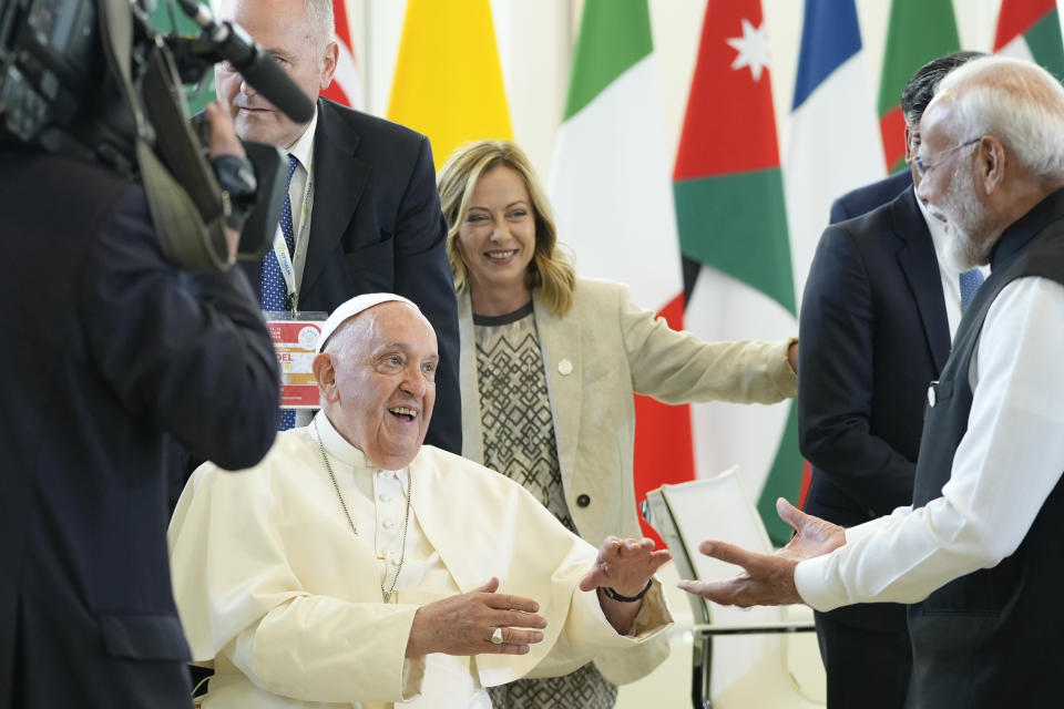 Indian Prime Minister Narendra Modi, right, greets Pope Francis during a working session on AI, Energy, Africa and Mideast, at the G7, Friday, June 14, 2024, in Borgo Egnazia, near Bari, southern Italy. (AP Photo/Alex Brandon)