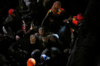 <p>Paramedics evacuate a woman rescued from the rubble of a six-story building that collapsed after days of heavy rain, in Nairobi, Kenya, April 30, 2016. <i>(Photo: Stringer/Reuters)</i></p>