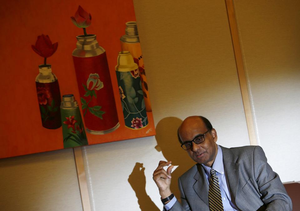 Singapore&#39;s Finance and Deputy Prime Minister Tharman Shanmugaratnam speaks to Reuters during an interview at his office in Singapore in this June 5, 2014 file photo. As the People&#39;s Action Party (PAP) settles down to another five years in power, the guessing game of who will succeed Prime Minister Lee Hsien Loong has begun - and the name of Tharman Shanmugaratnam keeps coming up. The odds of Shanmugaratnam, who is deputy prime minister and finance minister, making it to the top job should be long.  REUTERS/Edgar Su/Files