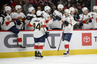 Florida Panthers left wing Jonathan Huberdeau (11) celebrates his goal during the first period of an NHL hockey game against the Washington Capitals, Friday, Nov. 26, 2021, in Washington. (AP Photo/Nick Wass)