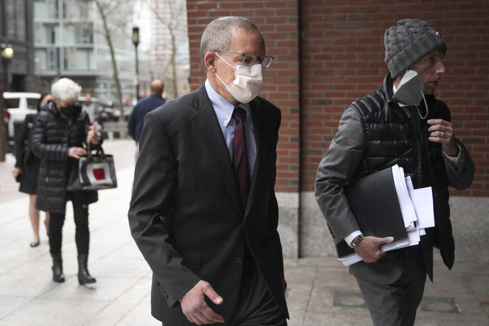 Charles Lieber, center, arrives at federal court in Boston, Wednesday, April 26, 2023. Lieber, a former Harvard University professor convicted of lying to federal investigators about his ties to a Chinese-run science recruitment program and failing to pay taxes on payments from a Chinese university, is scheduled to be sentenced Wednesday. (AP Photo/Steven Senne)