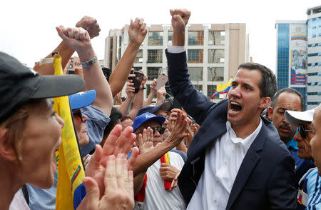 Juan Guaido, President of Venezuela's National Assembly, reacts during a rally against Venezuelan President Nicolas Maduro's government and to commemorate the 61st anniversary of the end of the dictatorship of Marcos Perez Jimenez in Caracas, Venezuela January 23, 2019. REUTERS/Carlos Garcia Rawlins