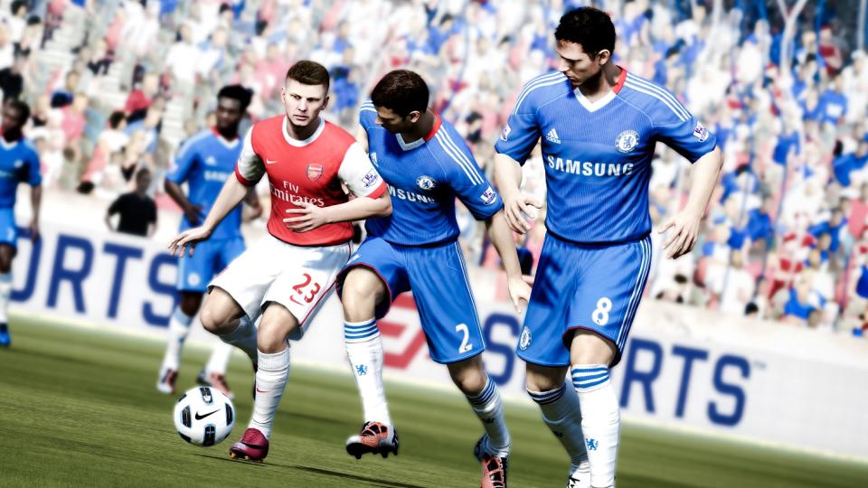 Five players in a FIFA video game with EA Sports banner in background.