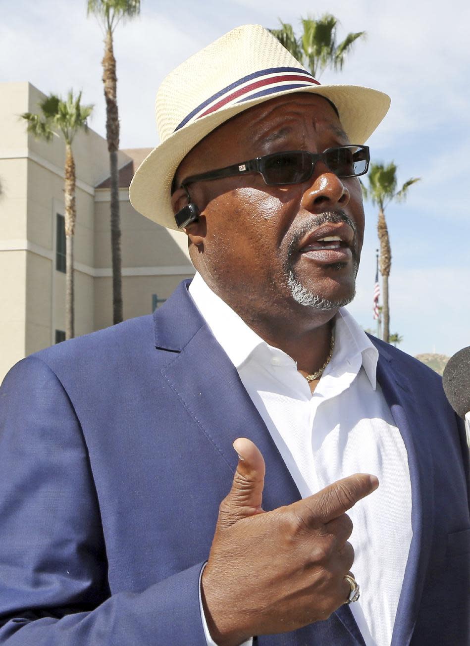 Gregory Clayborn, the father of one of those killed, speaks to reporters after Enrique Marquez Jr. pleaded guilty to providing the high-powered rifles used to kill 14 people in the San Bernardino terror attack, in federal court in Riverside, Calif., Thursday, Feb. 16, 2017. The judge accepted his plea agreement with prosecutors. Clayborn opposed the plea agreement in remarks to the judge before the hearing. (AP Photo/Reed Saxon)