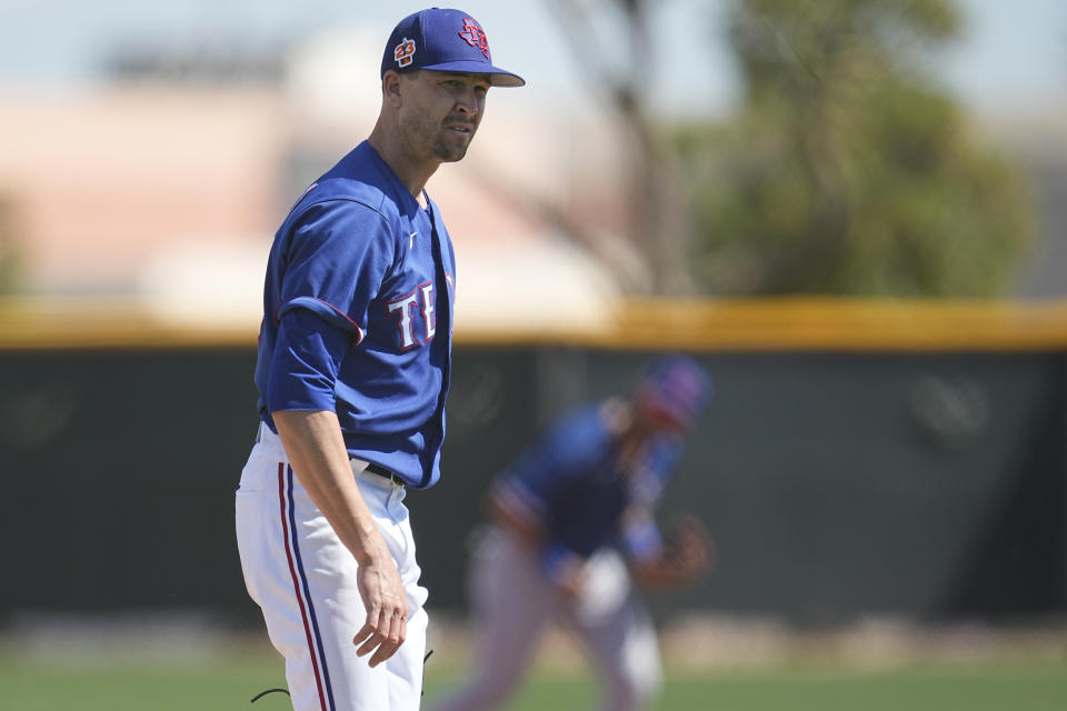 Texas Rangers starting pitcher Jacob deGrom walks back to the dugout after completing the first inning of a AA baseball rehabilitation start for the Frisco RoughRiders against the Northwest Arkansas Naturals, Monday, March 13, 2023, in Surprise, Ariz. (AP Photo/Abbie Parr)