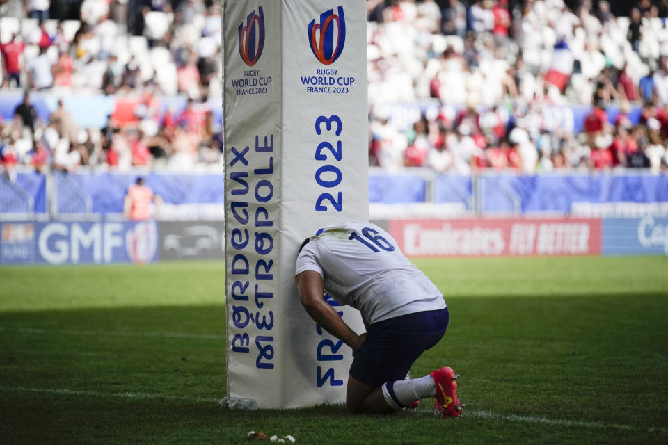 Samoa's Sama Malolo kneels on the field during the Rugby World Cup Pool D match between Samoa and Chile at the Stade de Bordeaux in Bordeaux, France, Saturday, Sept. 16, 2023. (AP Photo/Christophe Ena)