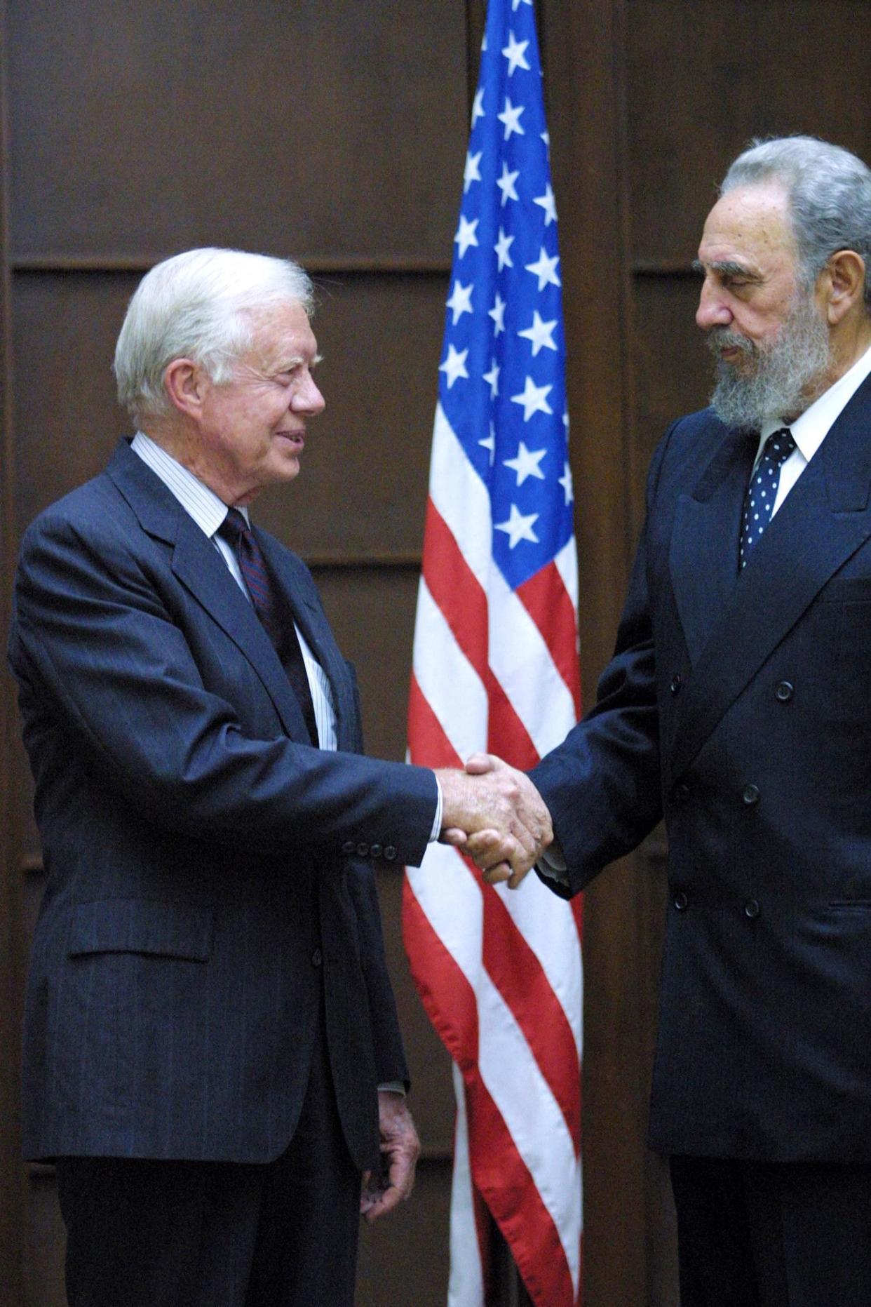 Cuban President Fidel Castro, right, welcomes former President Jimmy Carter to the Revolution Palace on May 12, 2002, on the first day of the former president's six-day visit in Havana, Cuba. Former President Carter is the first U.S. president, in or out of office, to visit Cuba since Castro came to power in 1959.