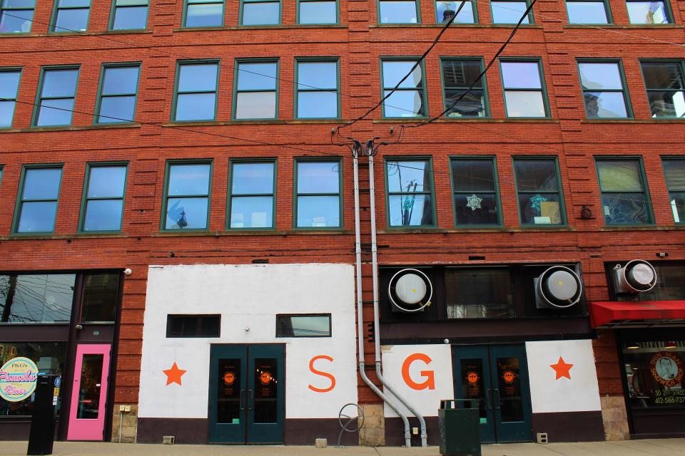 This undated photo provided by the Galley Group shows the exterior of Smallman Galley in Pittsburgh’s Strip District, once an industrial neighborhood and now home to robotics startups and Argo AI. A mix of homegrown chefs and transplants from other cities have been opening risk-taking and award-winning restaurants in Pittsburgh, offering creative spins on American food and authentic takes on cuisines like Venezuelan and Vietnamese that would have been hard to find less than a decade ago. (Galley Group via AP)