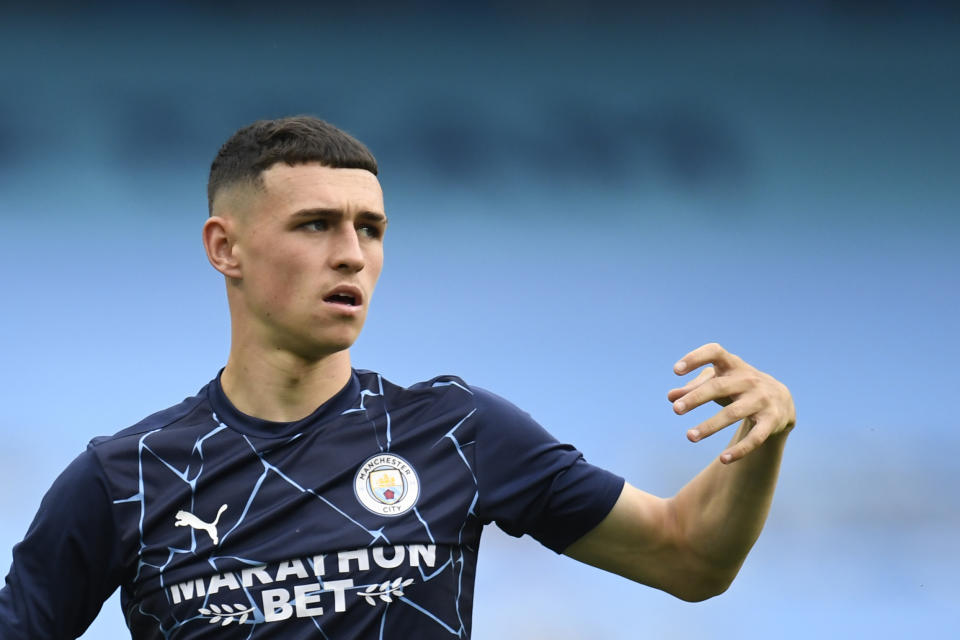 Manchester City's Phil Foden warms up before the Champions League, round of 16, second leg soccer match between Manchester City and Real Madrid at the Etihad Stadium stadium in Manchester, England, Friday, Aug. 7, 2020. (Peter Powell/Pool Photo via AP)