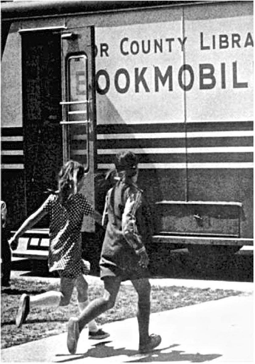 Two girls run to the Door County Bookmobile in a photo from the late 1960s or early '70s. The bookmobile has been out of service since 1989 but has been bought and restored and will return to making the rounds across the county.