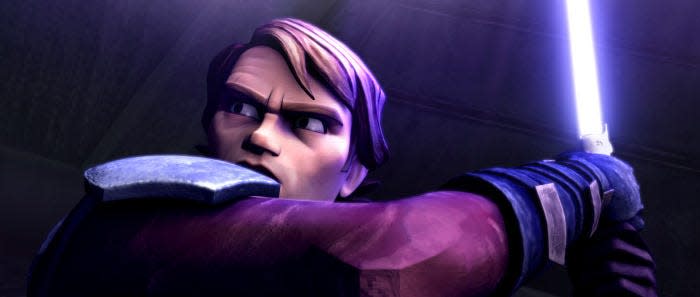 Jedi Knight Anakin Skywalker, his lightsaber at the ready, prepares for battle in STAR WARS: THE CLONE WARS.