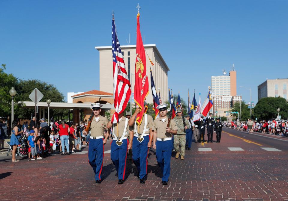Marines start off the Bolton Oil Parade on Broadway on Monday, July 4, 2022.