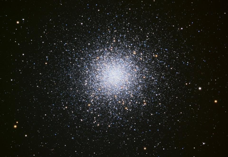 The magnificent M13 globular cluster, photographed by a 24-inch telescope at the Mount Lemmon SkyCenter.  M13 contains hundreds of thousands of stars and is 145 light years across. The cluster is over 22,000 light years away. CC BY-SA 4.0 International license.