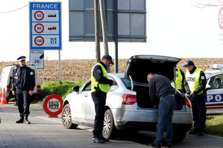 French police conduct a control at a rood block at the border between Belgium and France as security increases ahead of the World Climate Change Conference 2015 (COP21) in Neuville-en-Ferrain, France, November 13, 2015. REUTERS/Pascal Rossignol