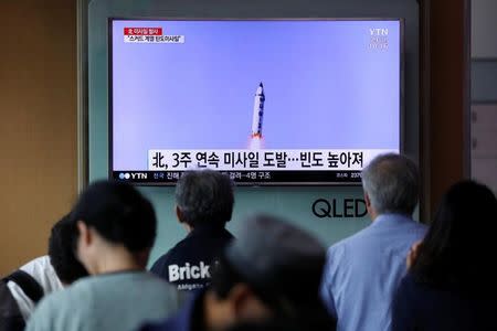 People watch a television broadcasting a news report on North Korea firing what appeared to be a short-range ballistic missile, at a railway station in Seoul, South Korea, May 29, 2017. REUTERS/Kim Hong-Ji