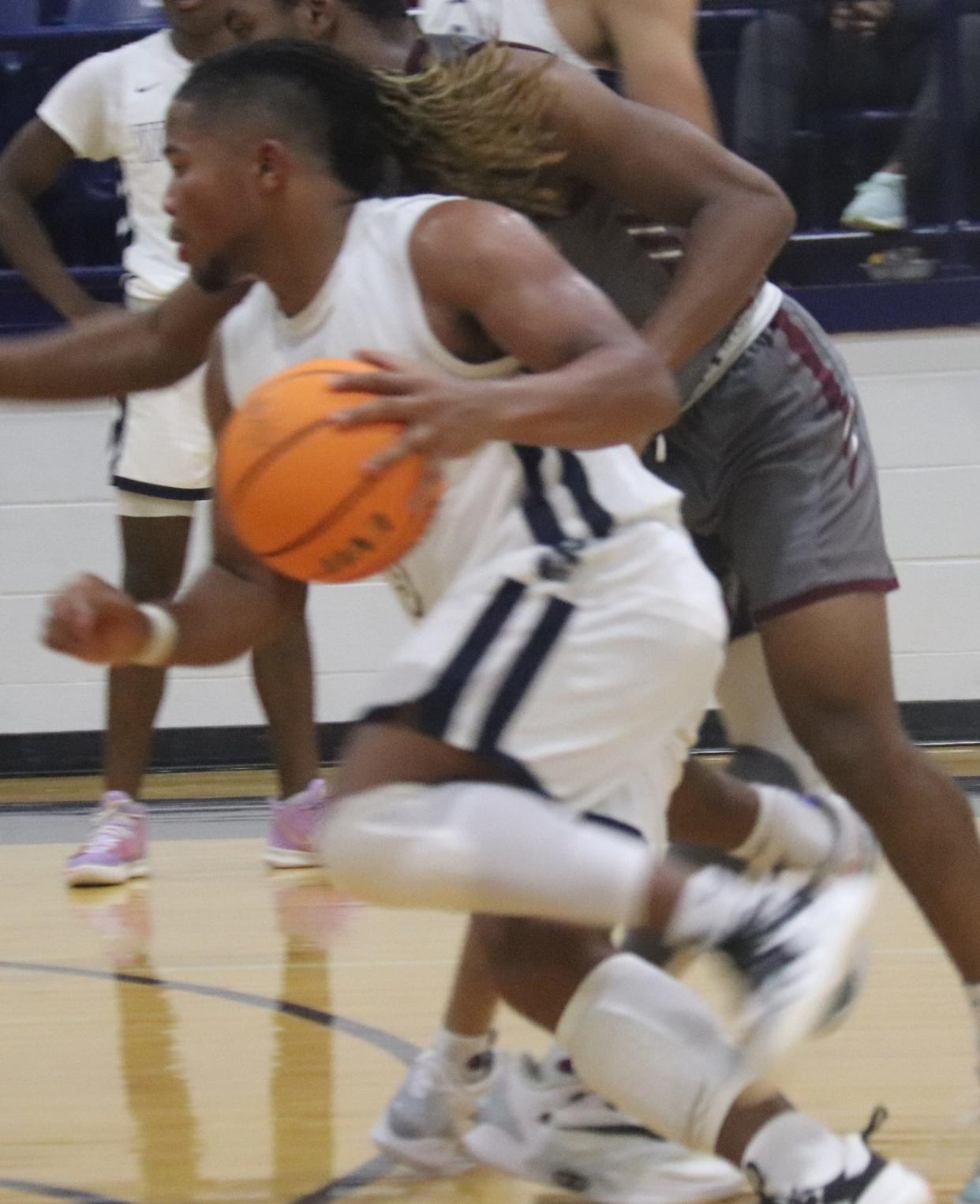 Shawnee's Jaylon Orange drives the basketball during an earlier season game.