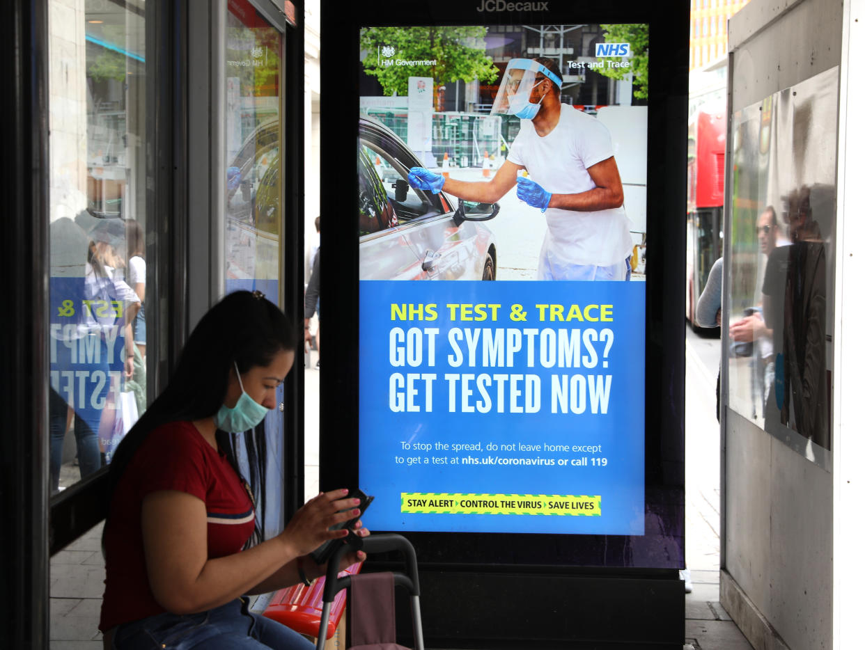 A screen on a bus stop displaying a NHS notice on test and trace on Oxford Street, London, as non-essential shops in England open their doors to customers for the first time since coronavirus lockdown restrictions were imposed in March. Picture date: Monday June 15, 2020.