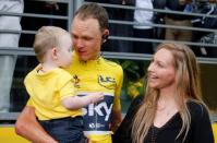 Cycling - The 104th Tour de France cycling race - The 103-km Stage 21 from Montgeron to Paris Champs-Elysees, France - July 23, 2017 - Team Sky rider and yellow jersey Chris Froome of Britain with his wife and child after the finish. REUTERS/Pascal Rossignol