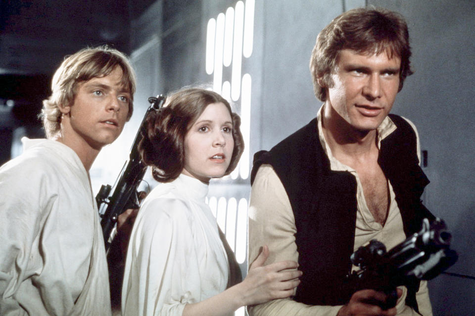 American actors Mark Hamill, Carrie Fisher and Harrison Ford on the set of Star Wars: Episode IV - A New Hope.<span class="copyright">Sunset Boulevard/Corbis/Getty Images</span>
