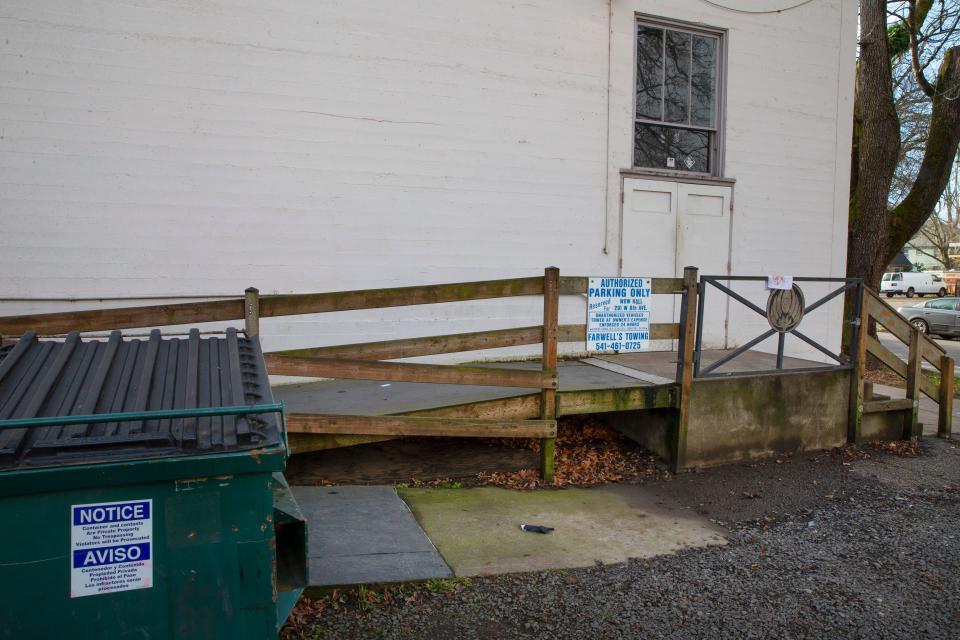 A rag with what appears to be blood stains on it drapes the railing at the backdoor of the the WOW Hall in Eugene the morning after the shooting.