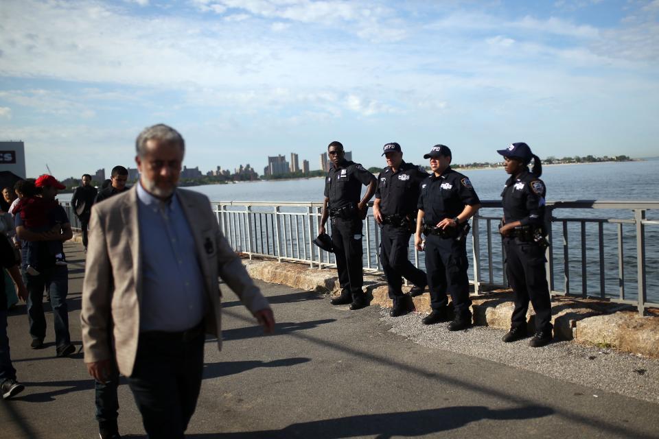 Muslims walk to Bensonhurst Park to perform Eid-al-Fitr prayer in Brooklyn borough of New York, United States on June 25, 2017. Police forces took security measures during the event. Eid-al-Fitr is a holiday celebrated by Muslims worldwide that marks the end of Muslims' holy month of fasting Ramadan.