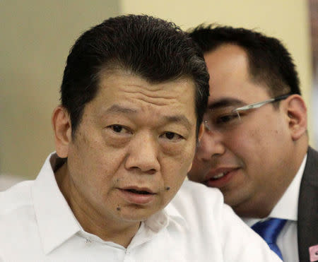 Chinese casino junket operator Kim Wong (L) listens to his legal counsel during a money laundering hearing at a hotel in metro Manila, Philippines May 19, 2016. REUTERS/Romeo Ranoco