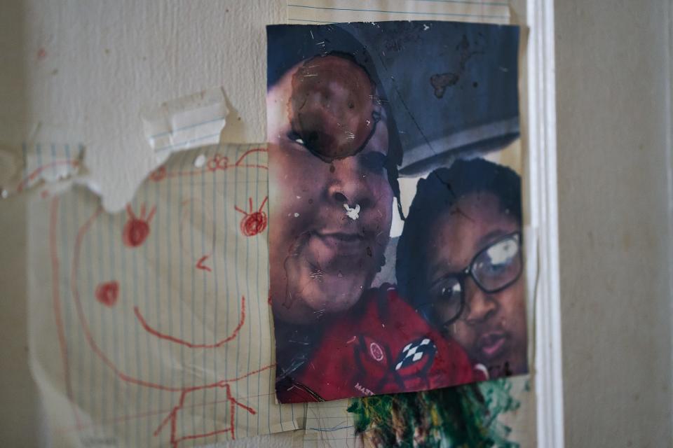 Pictures on Angelia Brooks' door show Chasity Cooper and her daughter, Doryan Bryant. The drawings were done by Doryan the day before the two were killed.