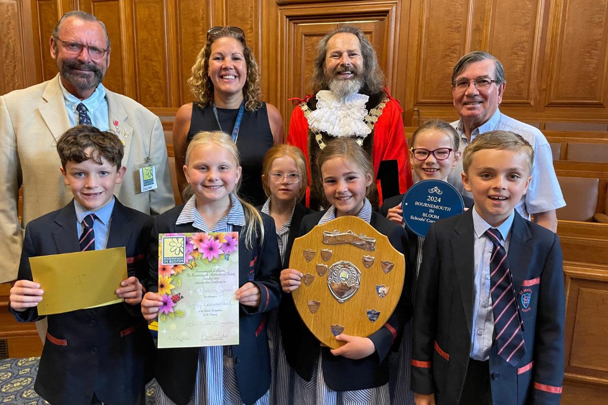 The award presentation featuring Mrs Male, headteacher at St Martin’s School, Mayor Farquhar, and other dignitaries alongside pupils from St Martin’s School <i>(Image: St Martin’s School)</i>