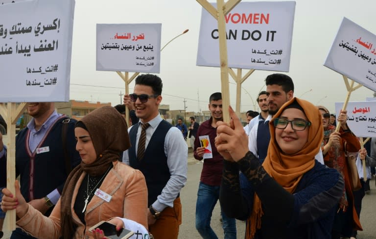 Iraqis take part in a Women's Day march in the city of Mosul on March 8, 2018 eight months after Iraqi forces retook the northern Iraqi city from Islamic State (IS) jihadists