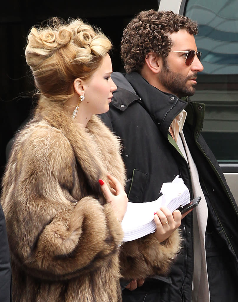 Exclusive... 51055576 "Silver Linings Playbook" costars Jennifer Lawrence and Bradley Cooper are back together again on the set of the new untitled David O. Russell film on April 2, 2013 in Boston, Massachusetts. The pair arrived on set together in full 70's wardrobe. Bradley "Sexiest Man Alive" Cooper is looking to one-up Christain Bale's movie comb-over with a nice head of short Jheri curls for his role in this film! NO INTERNET USE WITHOUT PRIOR AGREEMENT FameFlynet, Inc - Beverly Hills, CA, USA - 1 (818) 307-4813